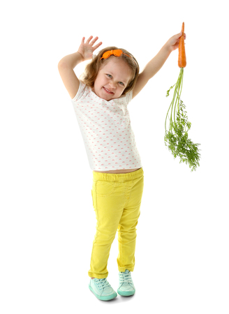 Beautiful girl with carrot, isolated on whiteの写真素材