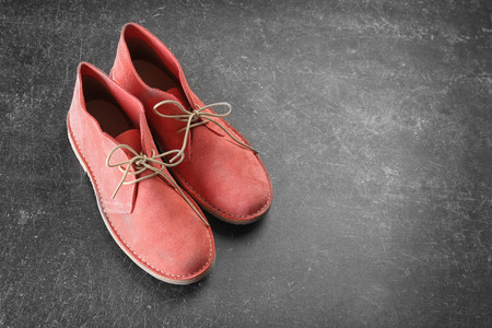 Red shoes on dark grey backgroundの写真素材