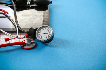 Medical concept. Medical manometer and a stethoscope on a blue backgroundの写真素材