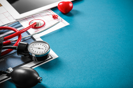 Medical concept. Medical manometer and a stethoscope on color backgroundの写真素材