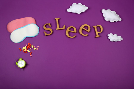 Sleep concept with accessories on color background
