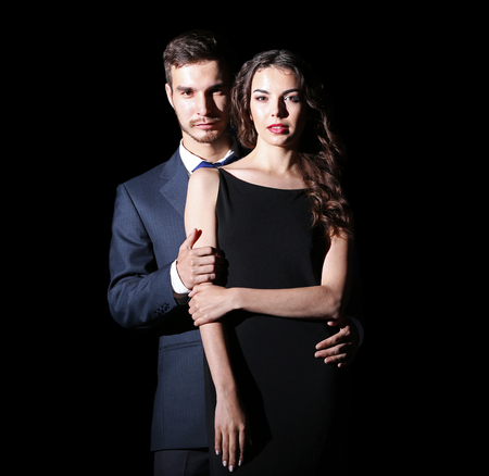 Elegant couple on dark backgroundの写真素材