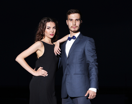 Elegant couple on dark backgroundの写真素材