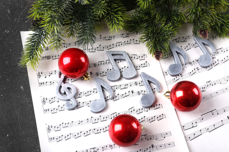 Christmas decorations on music sheetsの写真素材