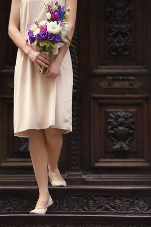 Woman holding bouquet of beautiful flowersの写真素材
