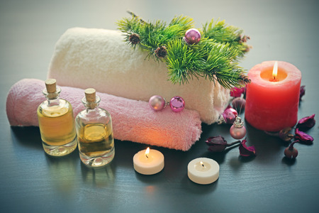 Spa treatment with Christmas decorations on wooden backgroundの写真素材