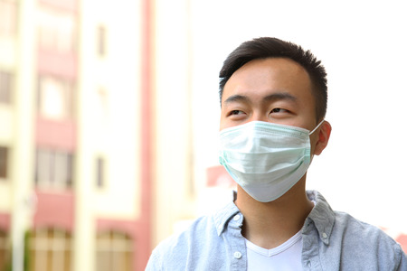 Ill man wearing mask on the street