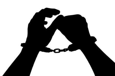 Black silhouette of man hands in handcuffs on light background