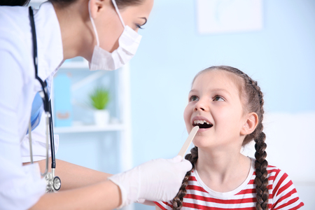 Cute girl visiting doctorの写真素材