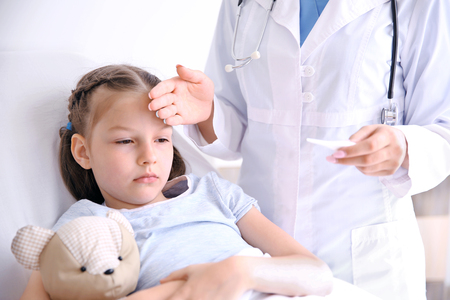 Cute girl visiting doctorの写真素材