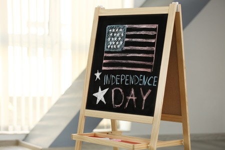 Child's chalk drawing of American flag on blackboardの写真素材