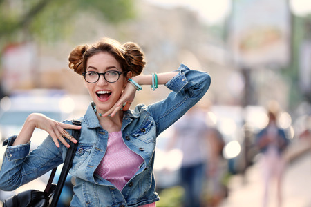 Playful young woman on blurred background