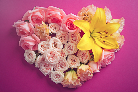 Heart shaped roses on purple backgroundの写真素材