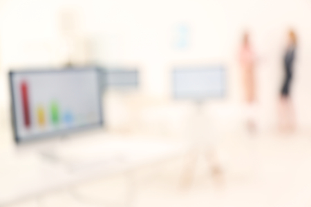 Modern computers and businesswomen at the meetingの写真素材