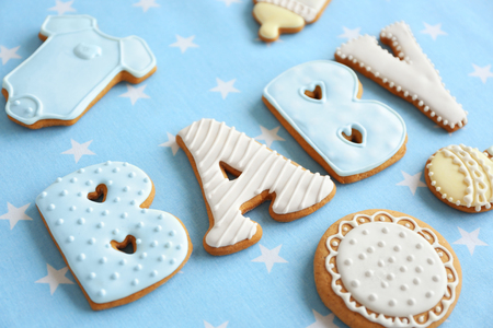 Baby glazed cookies on decorated tableの写真素材