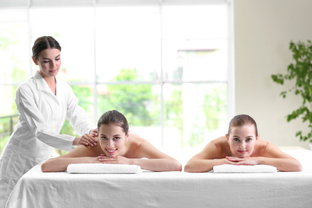 Beautiful girls relaxing in spa salonの写真素材