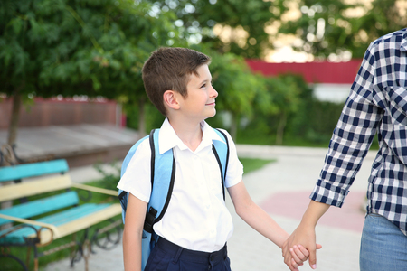Mother taking son to schoolの写真素材