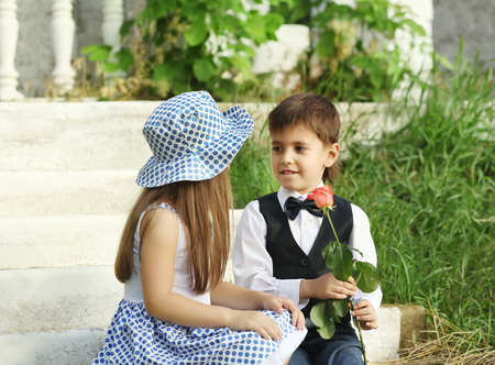 Small romantic kids on stairsの写真素材