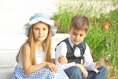 Small romantic kids on stairsの写真素材
