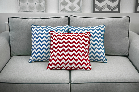 Comfortable sofa with pillows in the roomの写真素材