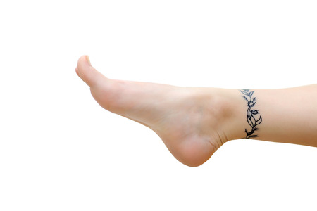 Female foot with tattoo on light backgroundの写真素材