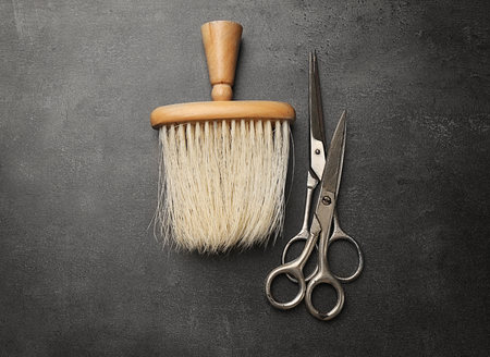 Vintage tools of barber shop on grey background