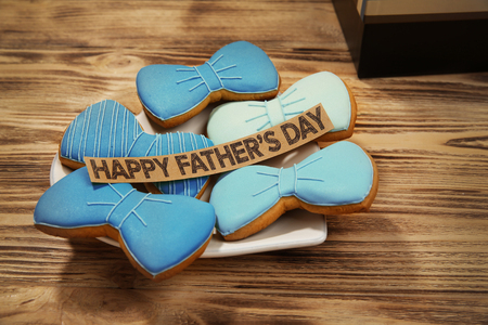 Happy Father's Day concept. Tasty cookies on wooden backgroundの写真素材