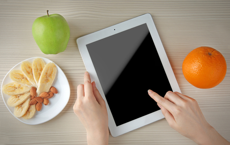 Woman counting calories, top viewの写真素材