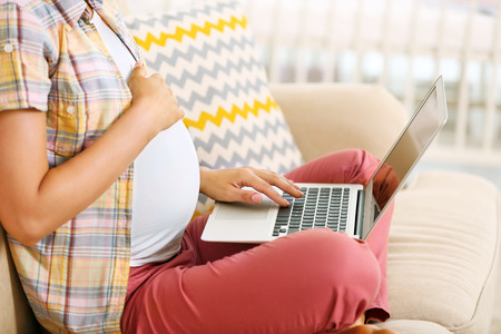 Pregnant woman shopping onlineの写真素材