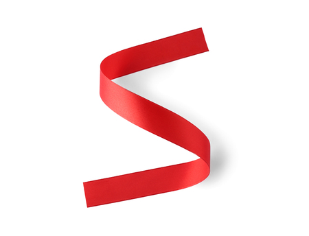 Silk red ribbon isolated on whiteの写真素材