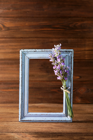Lavender with frame on wooden backgroundの写真素材