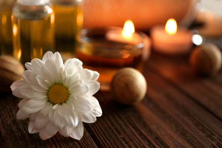 Beautiful spa set with flower on wooden tableの写真素材