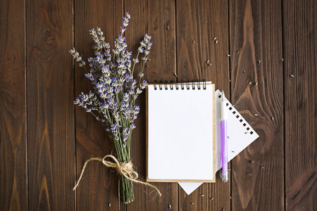 Lavender with notebook on wooden backgroundの写真素材
