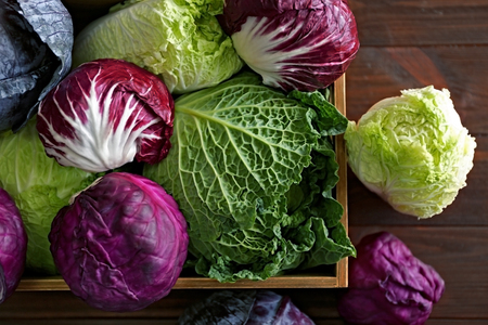 Fresh cabbage in wooden crate, closeup