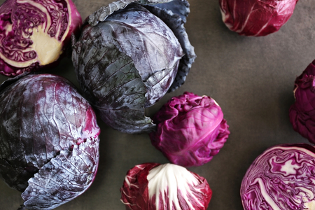 Red cabbage on grey background, top view