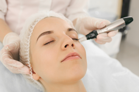Young woman visiting cosmetologistの写真素材