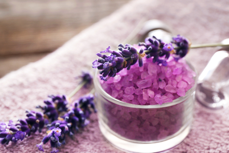 Purple sea salt with lavender on towelの写真素材