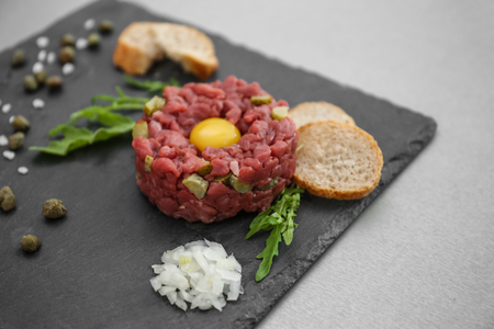 Tasty beef tartare on slateplateの写真素材