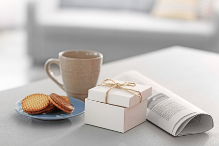 Happy Fathers Day concept. Tea cup with presents on tableの写真素材