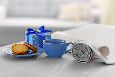 Happy Fathers Day concept. Tea cup with presents on tableの写真素材