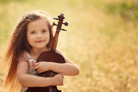 Beautiful girl playing violin