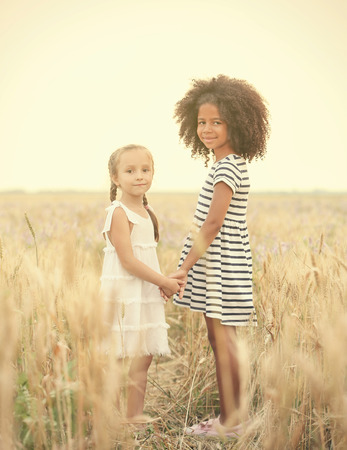 Happy children in the fieldの写真素材