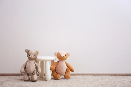 Children stool with toys on white wall backgroundの写真素材