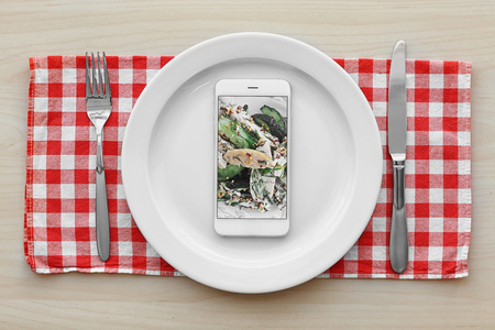 Cellphone on plate. Food blog conceptの写真素材