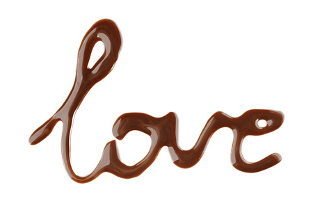 Word LOVE made of liquid chocolate, isolated on whiteの写真素材