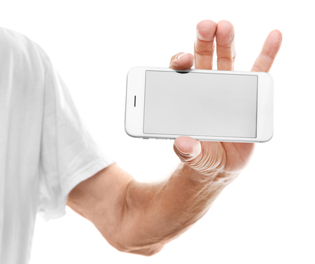Old man holding smartphone on a white backgroundの写真素材