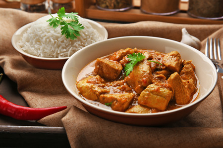 Tasty dinner with chicken curry in plate on trayの写真素材
