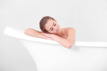 Beautiful girl relaxing in bathtub