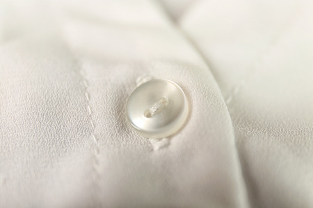 Button on clothes, close up