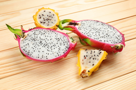 Dragon fruits on wooden backgroundの写真素材